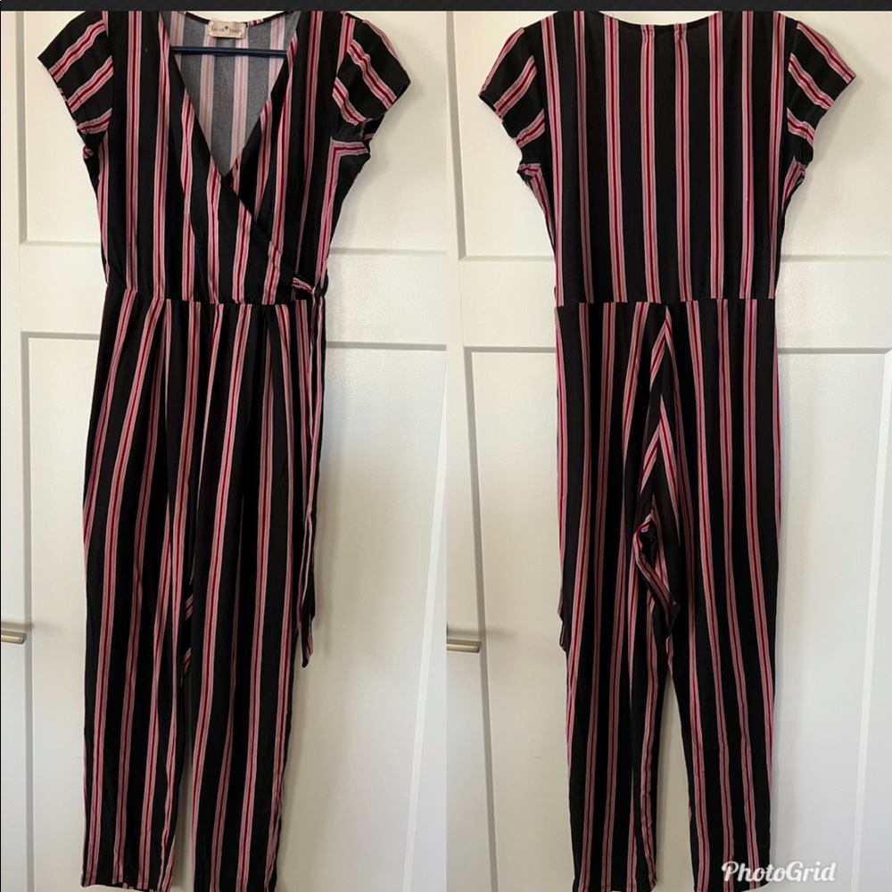Black jumpsuit with white, pink, & burgundy stripes by Derek Heart. Size: Small